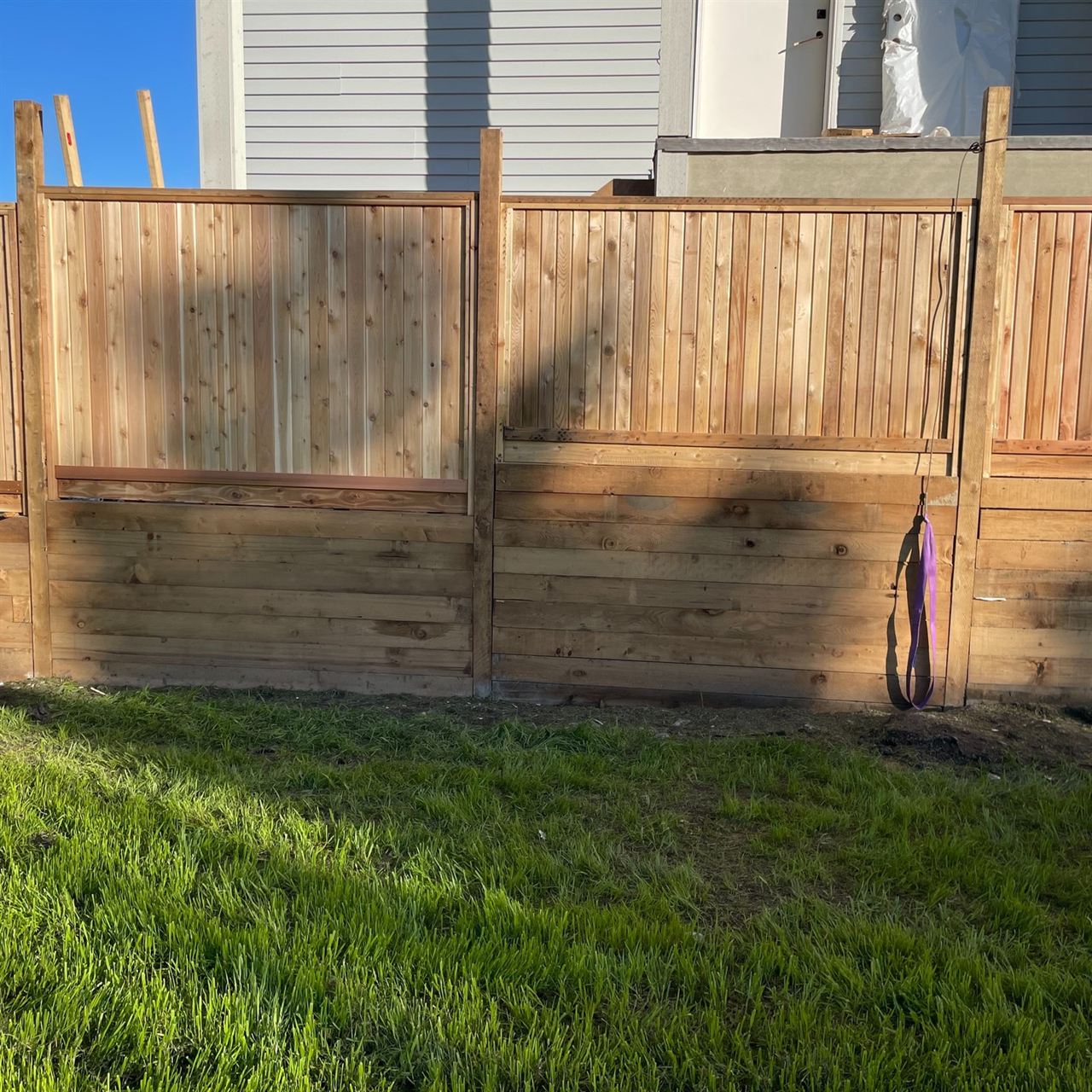 Cedar privacy fence with horizontal lower boards