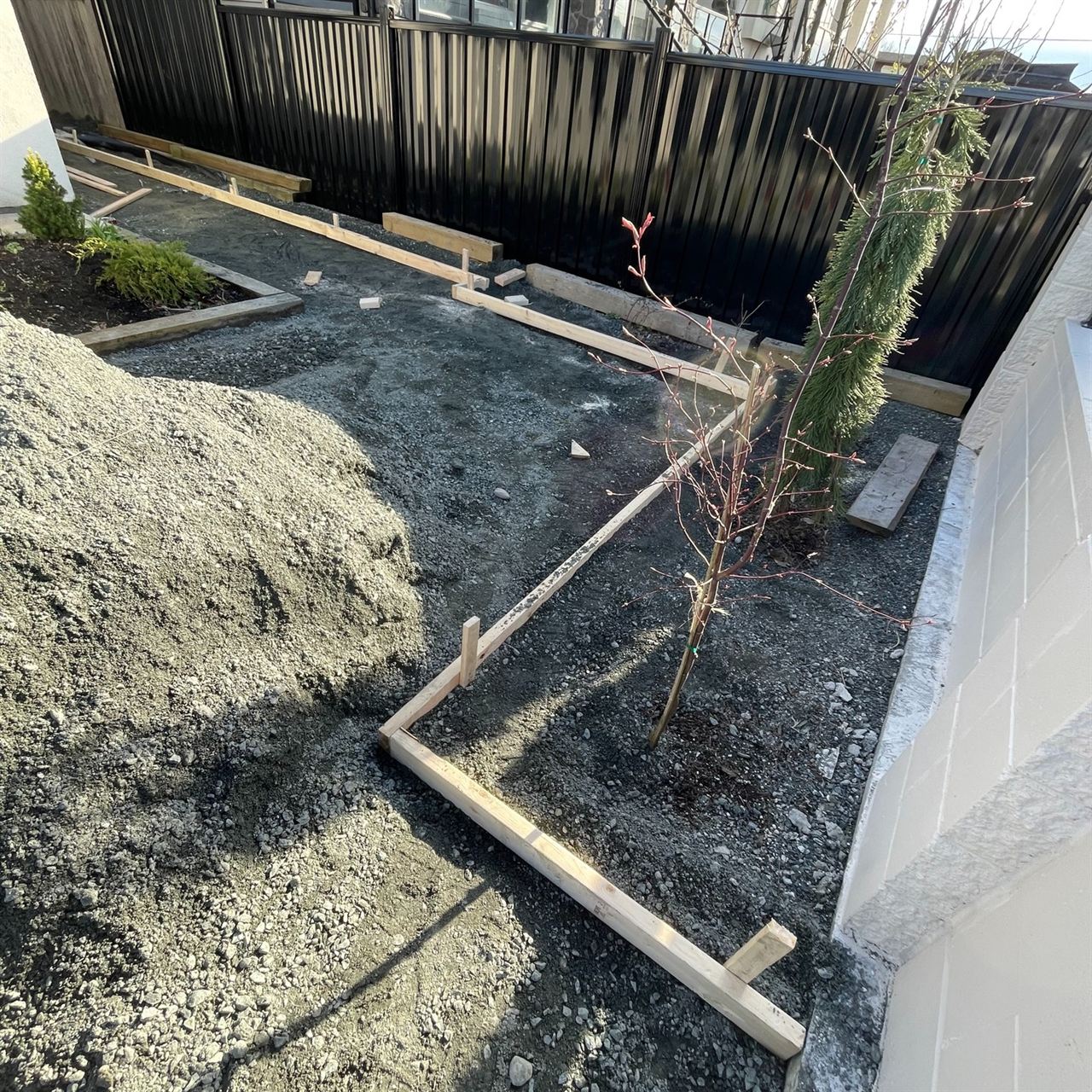 Asphalt paving forming — base prep and form boards set for surface pour