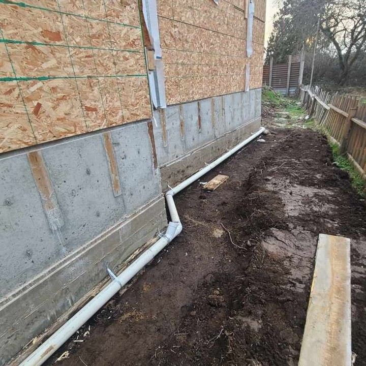 Perimeter drain tile running along a foundation wall