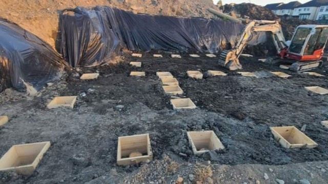 Footing formwork with excavator on site