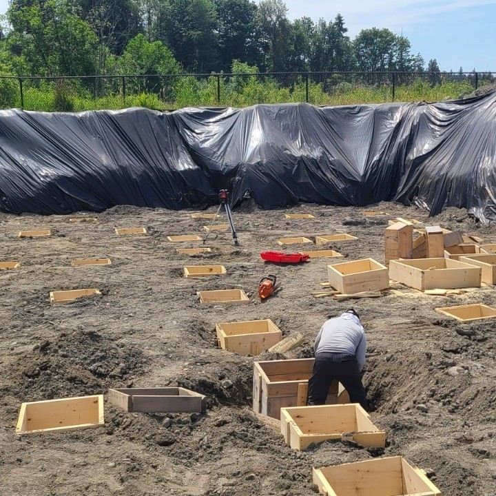 Footing forms and laser level set out on a large site